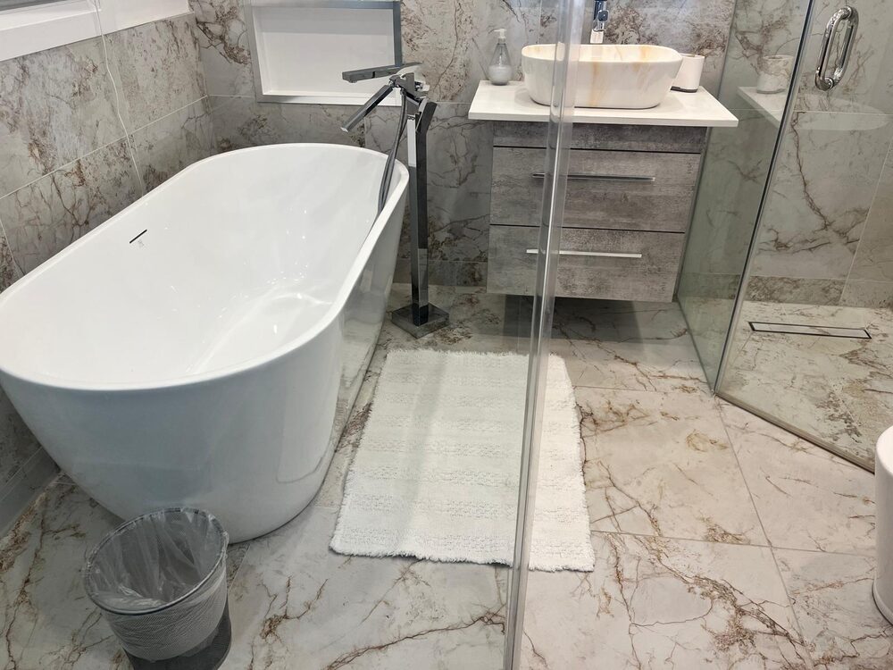 Freestanding tub and marble bathroom after a Mathi Cleaning Services deep clean