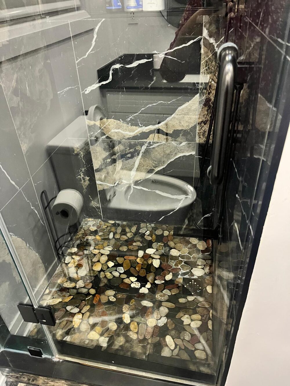 Ensuite bathroom with black marble finish, fully cleaned