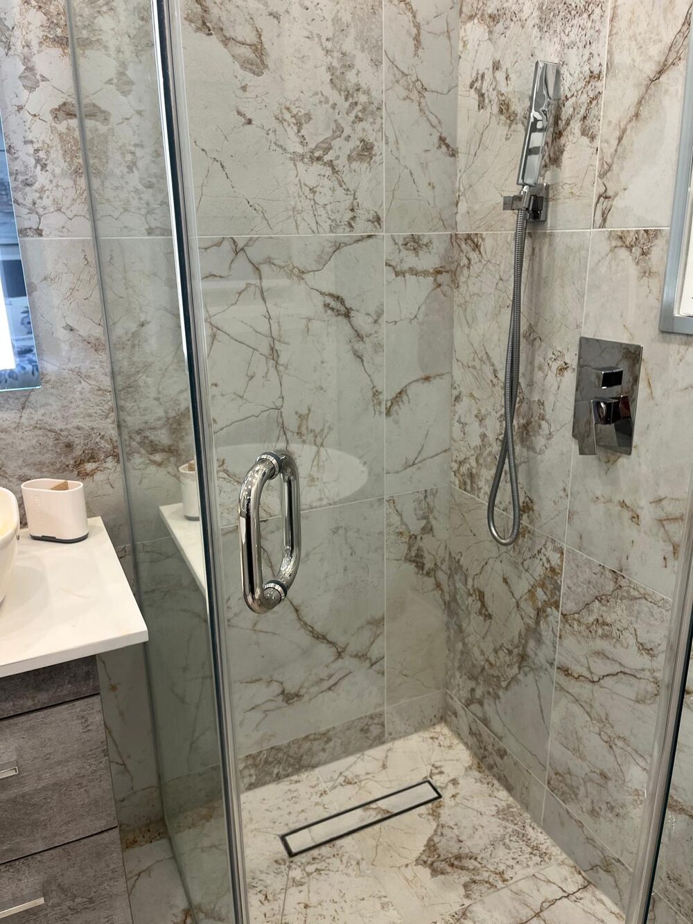 Marble shower stall cleaned and streak-free
